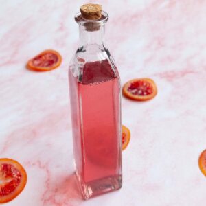 A bottle of blood orange simple syrup.
