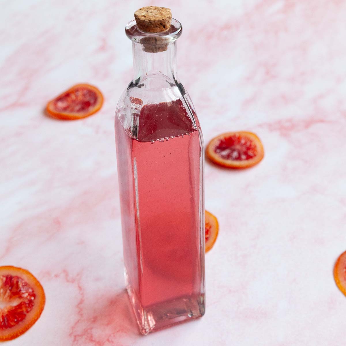 A bottle of blood orange simple syrup.