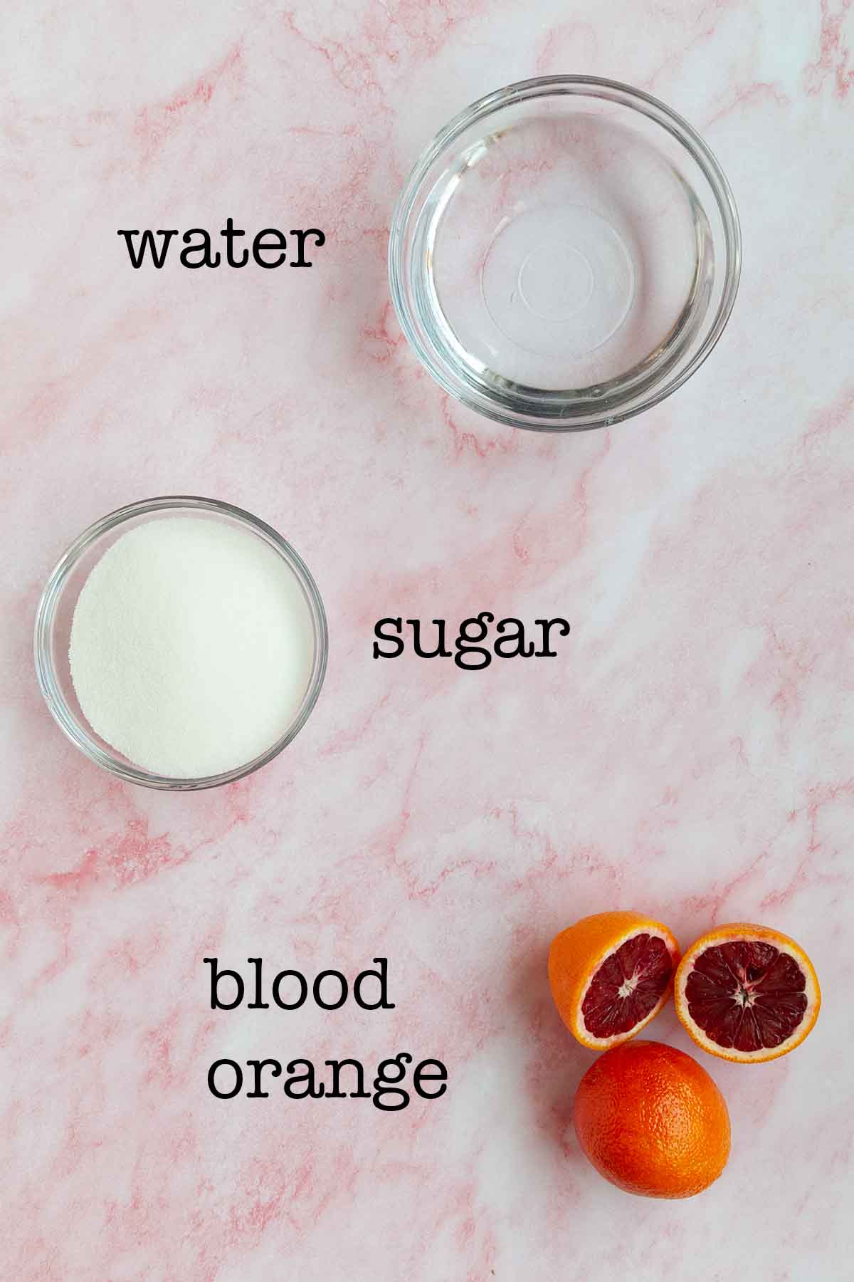 Ingredients for blood orange simple syrup--water, sugar, and blood oranges.