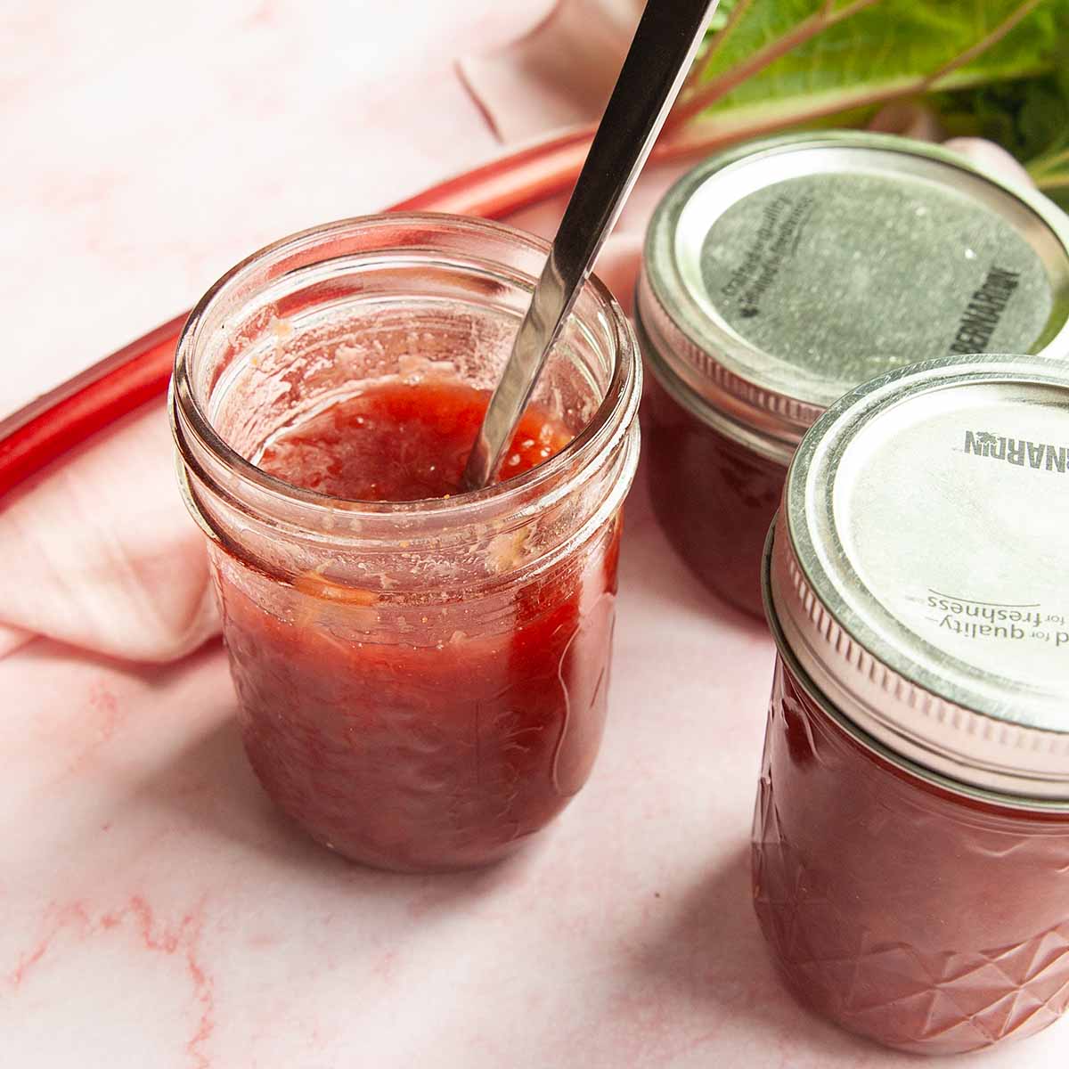 Three jars of rhubarb jam.