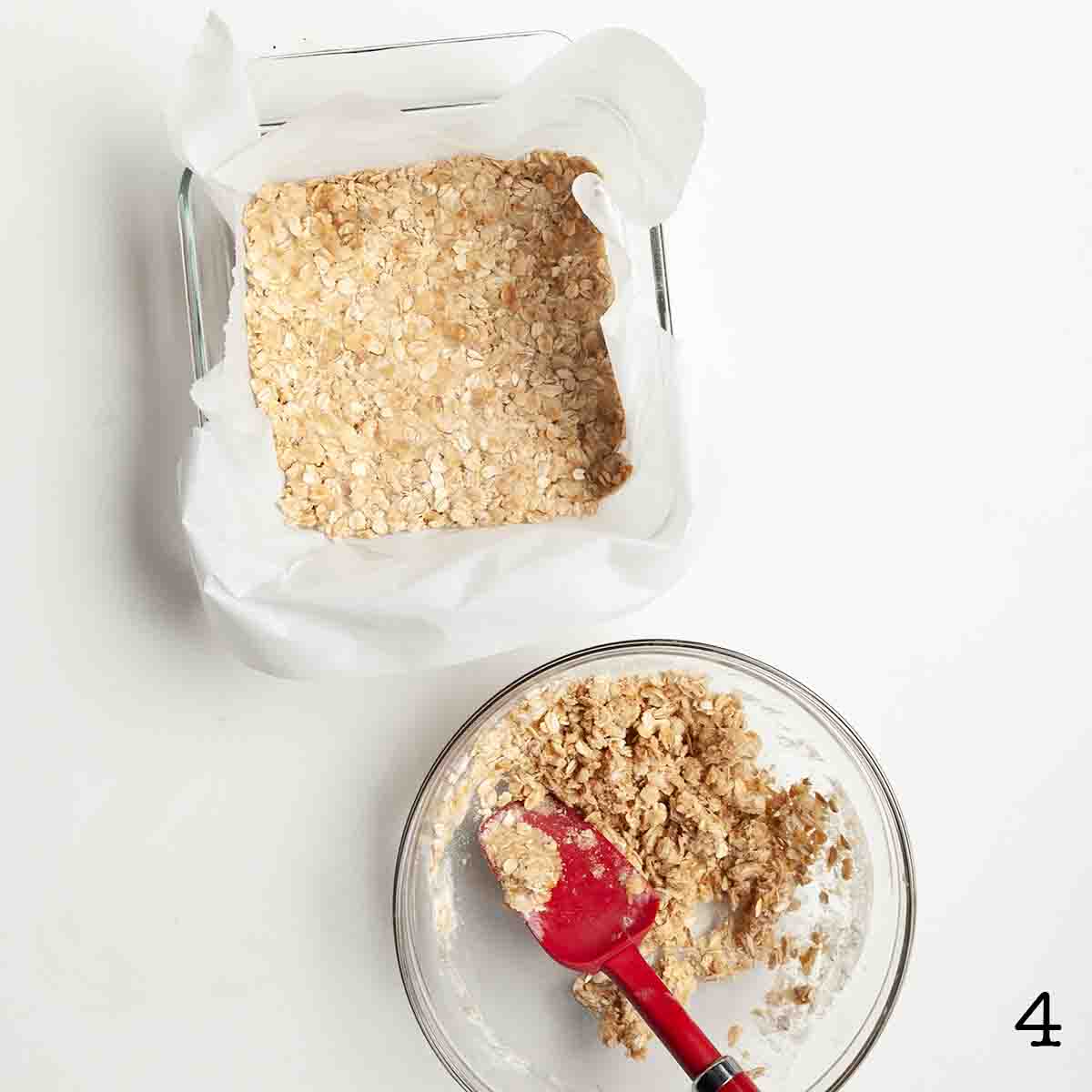 Oat bar dough pressed into a pan.