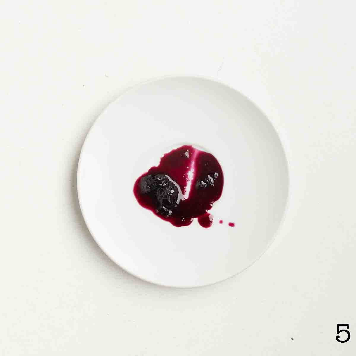 A dollop of jam on a plate.