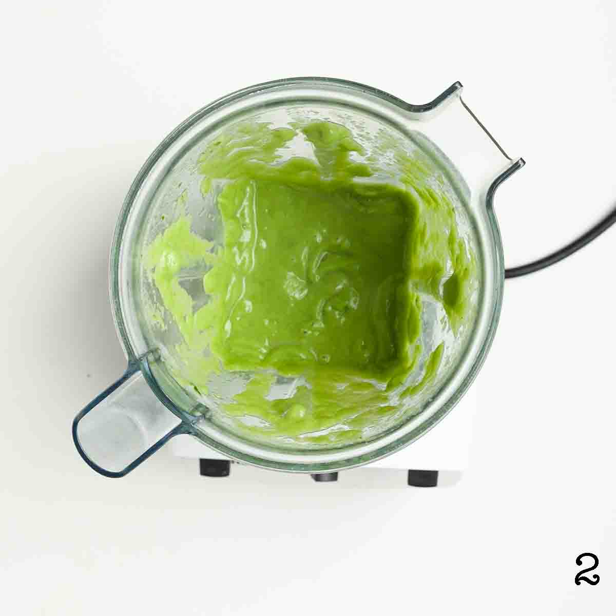 Green smoothie in a blender.