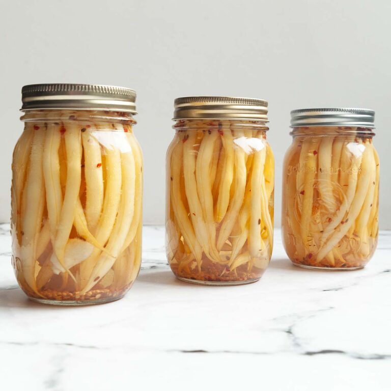 Three jars of pickled yellow beans.