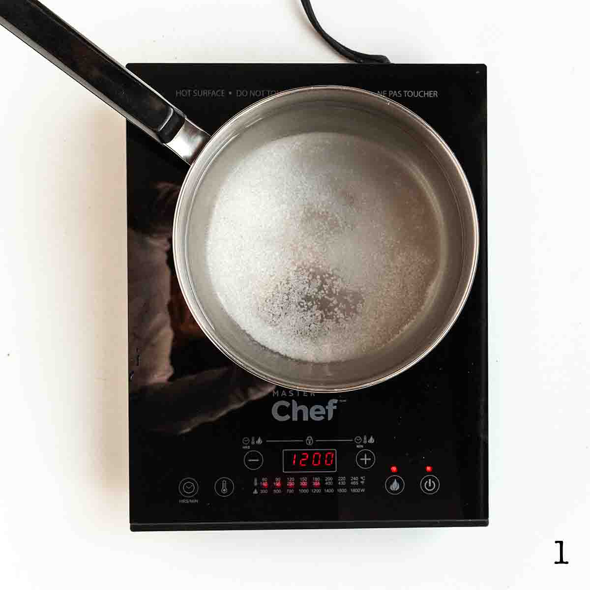 A pot with sugar and salt in liquid.