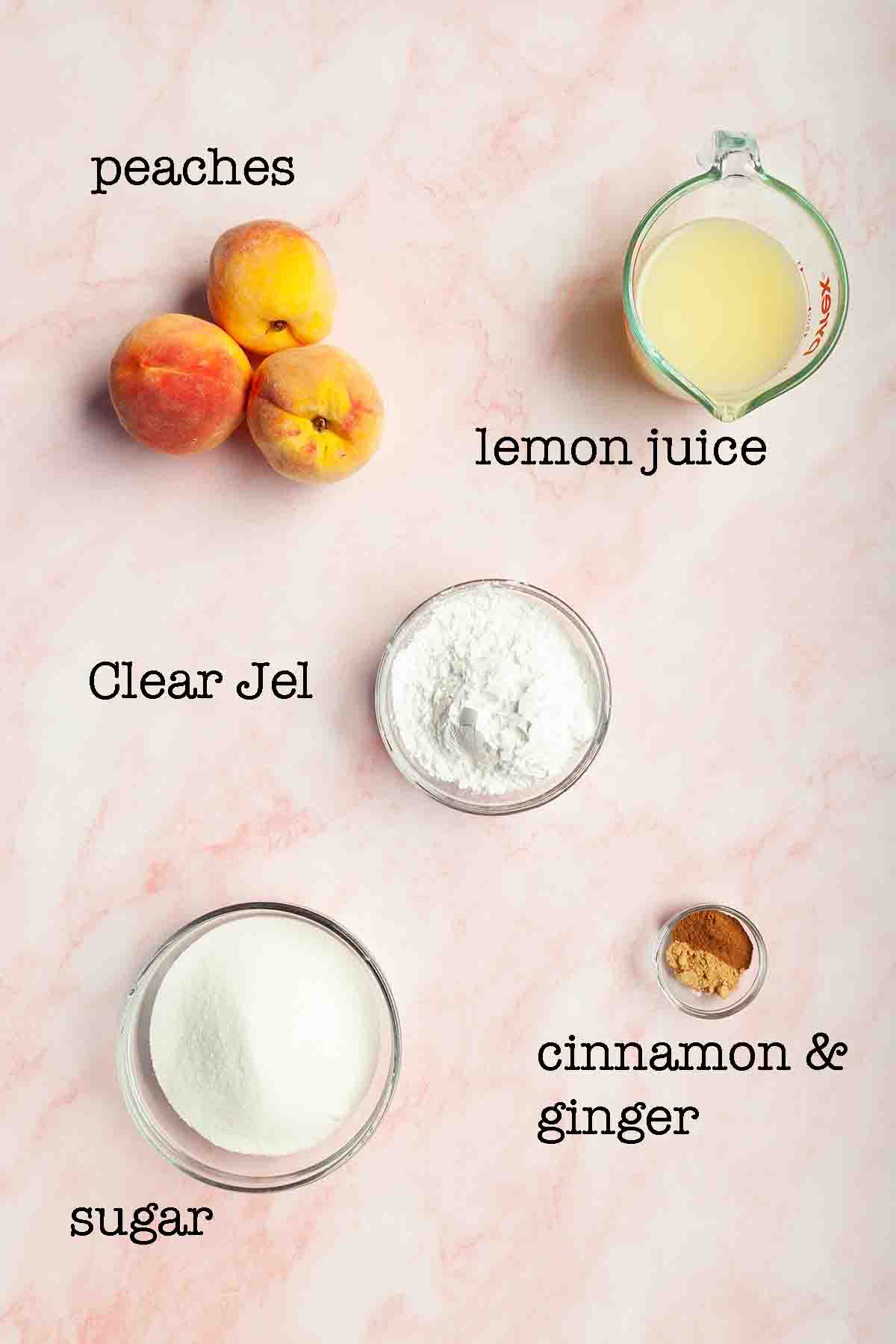 Ingredients for canned peach pie filling--peaches, lemon juice, clear jel, sugar, and cinnamon and ginger.