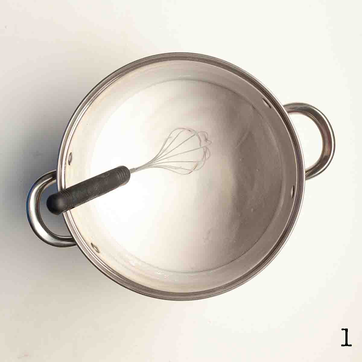Sugar and Clear Jel whisked together in a large pot.