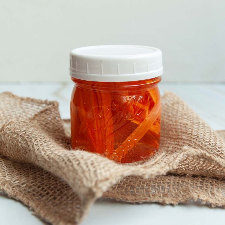 A jar of pickled shredded carrots.