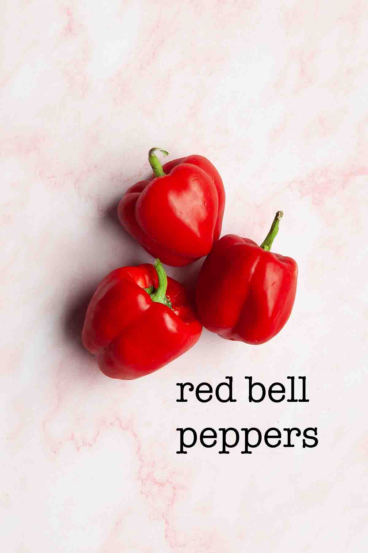Three red bell peppers.