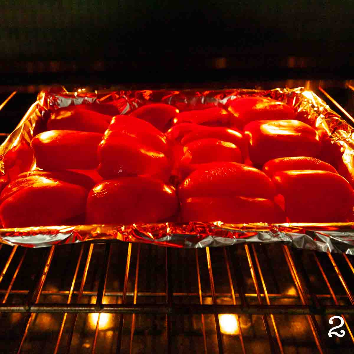 Bell peppers cooking in an oven.