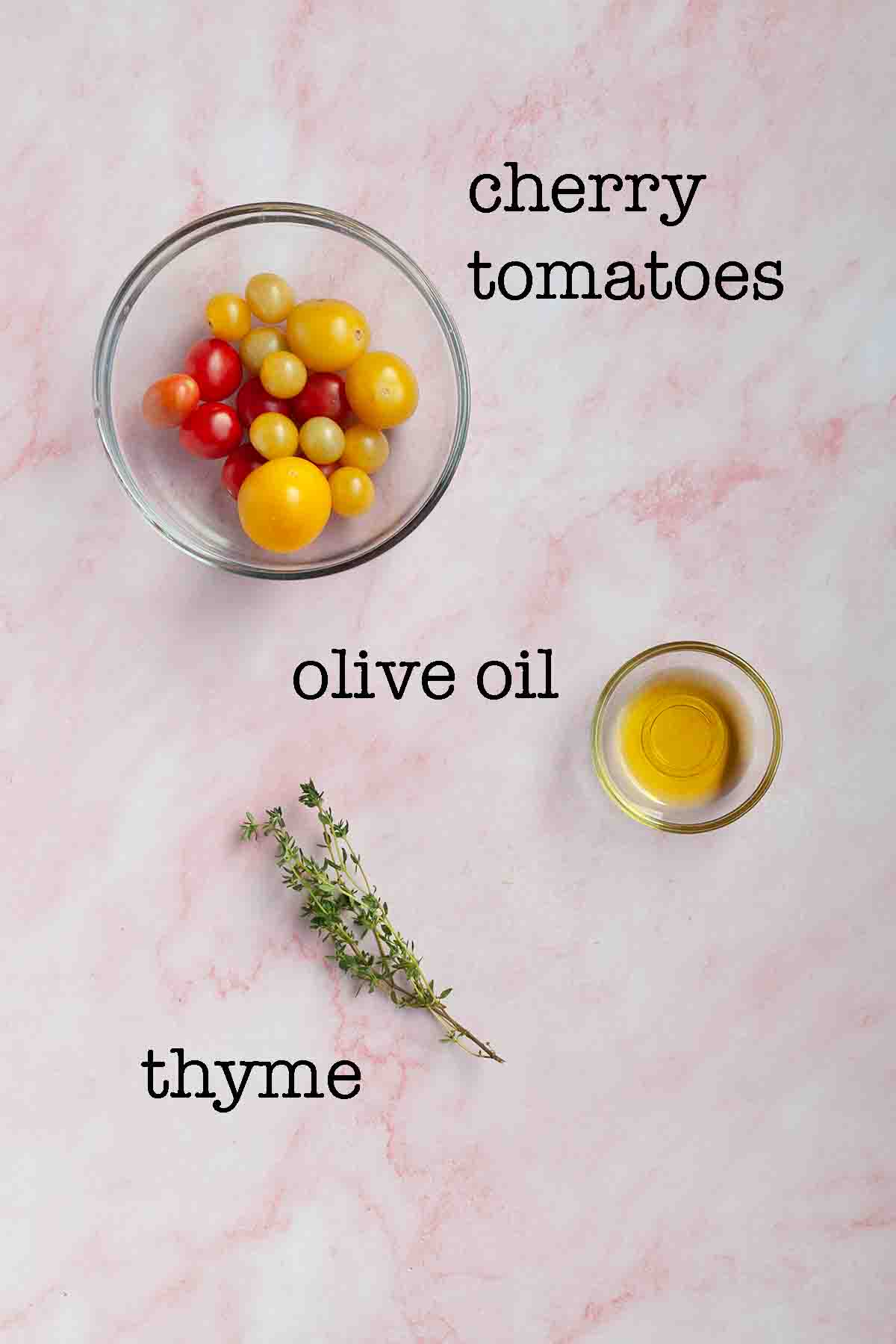 Ingredients for roasted cherry tomatoes--cherry tomatoes, olive oil, and thyme.